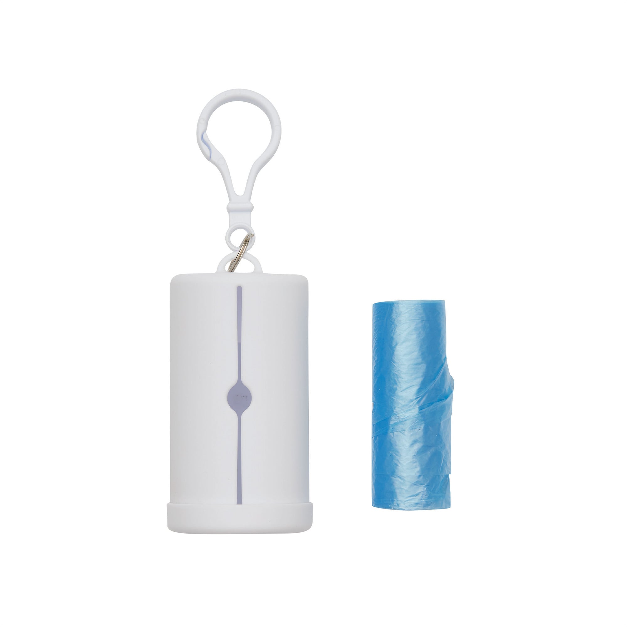 Dispensador blanco vertical con gancho y ranura frontal, junto a un rollo de bolsas celestes